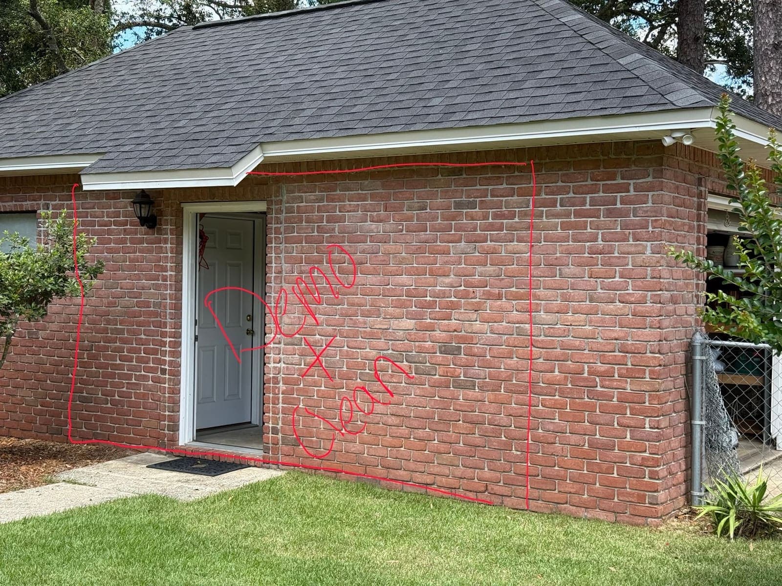 The existing brick wall marked out in red with the demolition line before work started