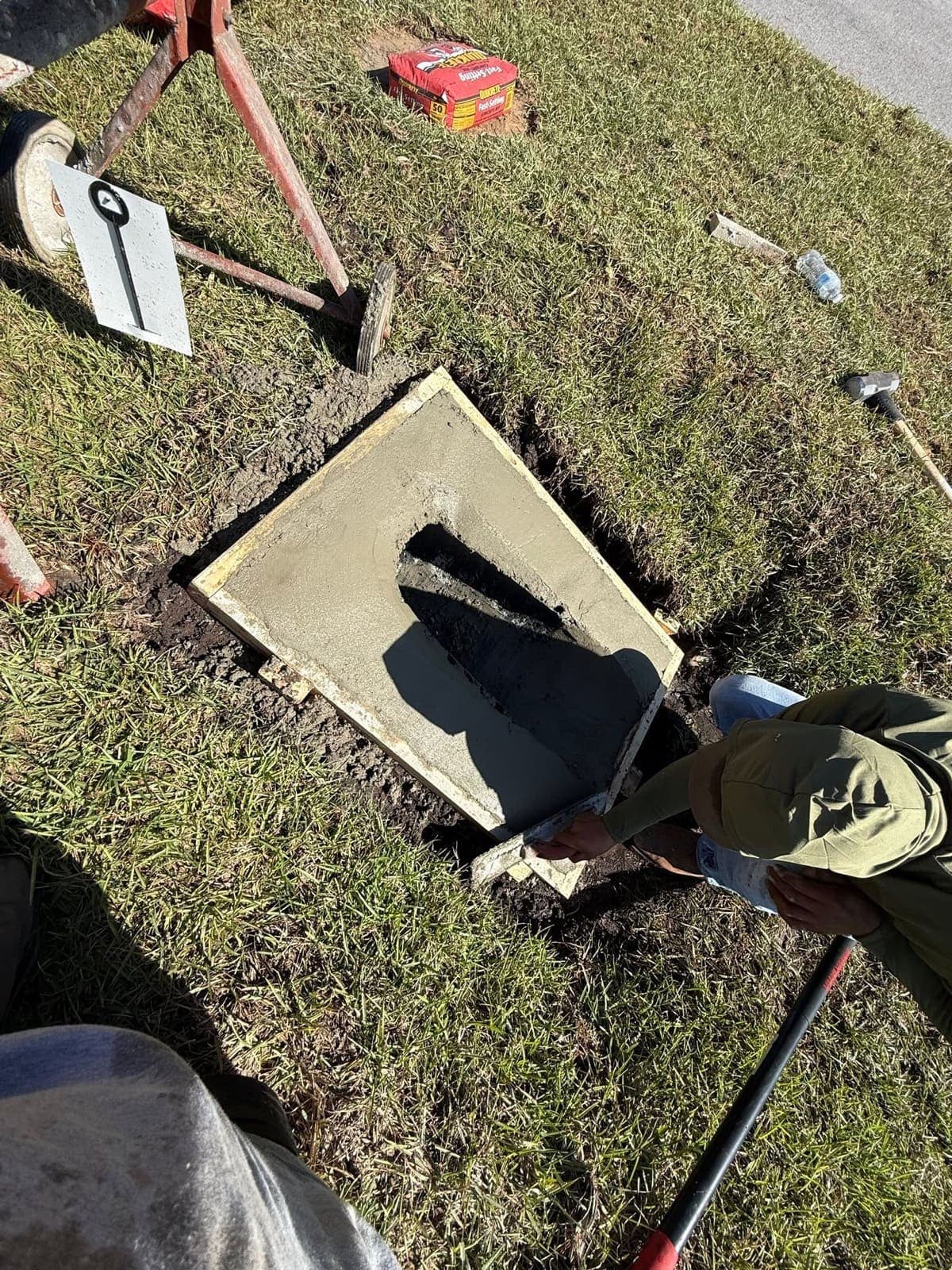 Catch basin box being formed and poured on site in the excavated drain run