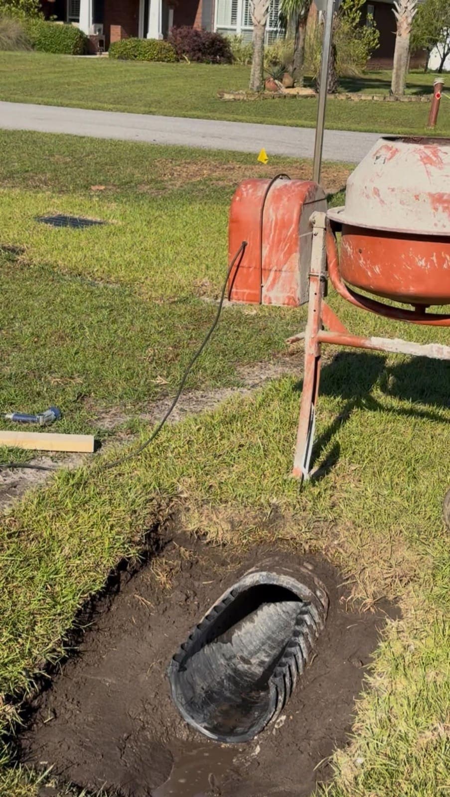 Corner lot with a low area that collected runoff before the drainage work